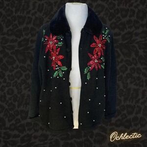 asic Editions Holiday knit black cardigan with red poinsettia embroidery.